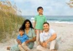 Family photo on the beach mother father two children ocean portrait Jonathan Starling